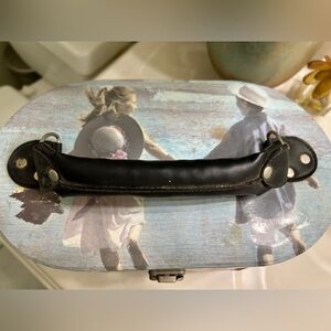 Vanity case. Well used for travel. Two compartments. About 10” wide, 5” tall.